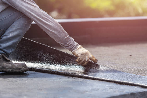 Professional Waterproofing technician working in Holt, MI